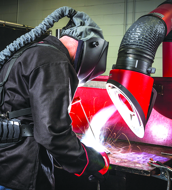 Stick welder using Viking PAPR (Powered Air Purifying Respirator) Helmet and Mobiflex 200-M welding fume extraction unit.